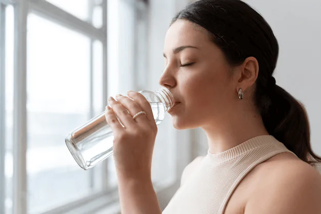 woman-drinking-water-after-exercise_23-2149240213_1